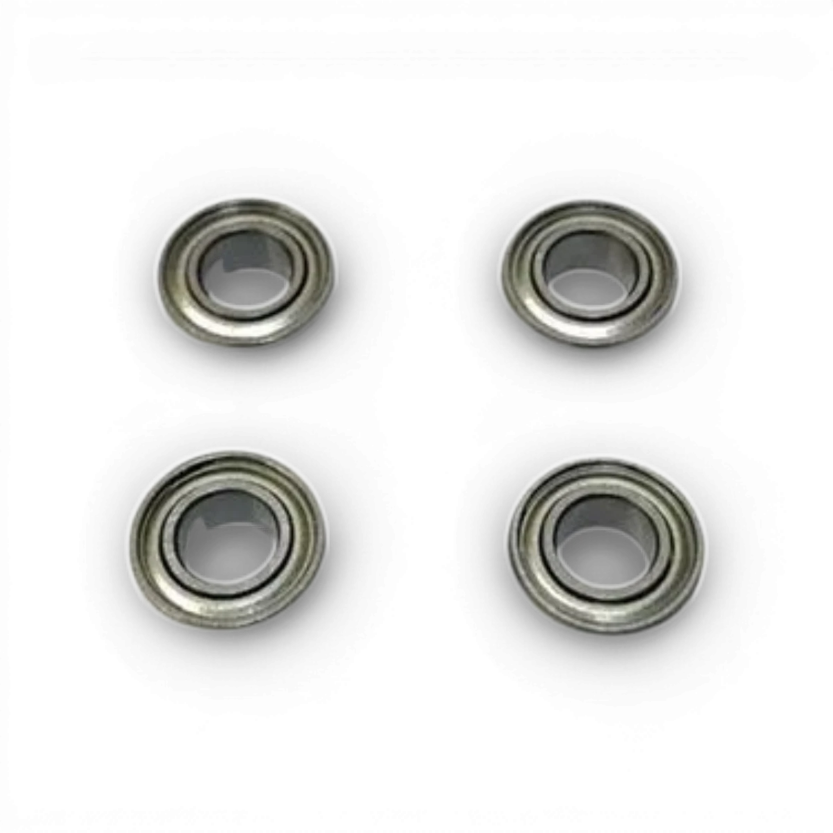 Quatre roulements 1050 en pièces détachées Topline, dimensions 10x5x4 mm, visibles en image, pour réparation ou assemblage.