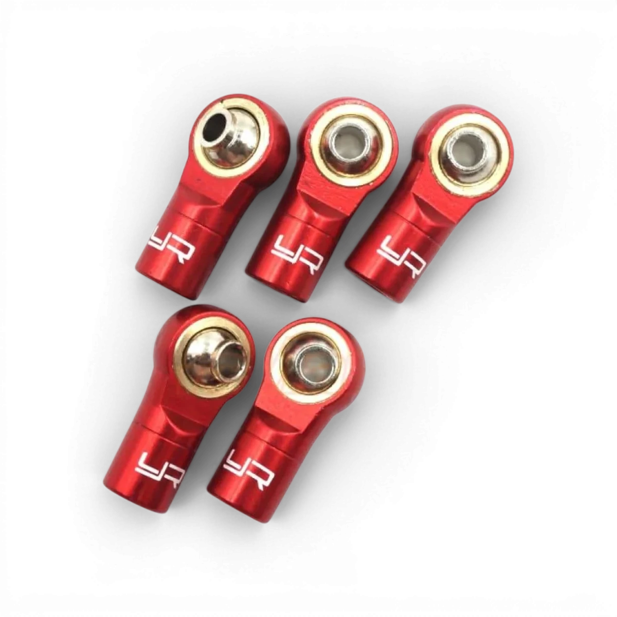 Chapes en aluminium pas inversé de couleur rouge pour modèle RC, par la marque Yeah Racing, visible en gros plan.