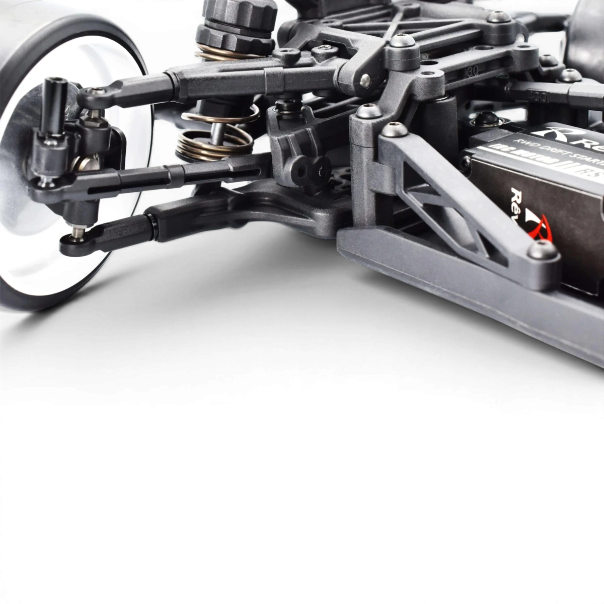 Châssis de drift RDX de Team Reve D, noir avec détails en rouge, conçu pour voitures RC de course.