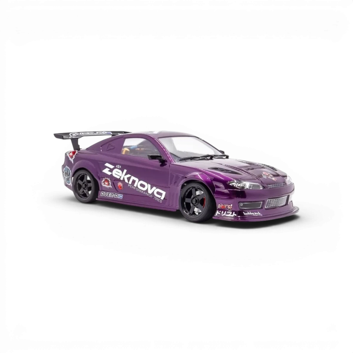 Châssis RC drift HOBBYTECH OVER-D10 RTR Brushless RWD avec roues et composants visibles, prêt pour la course.