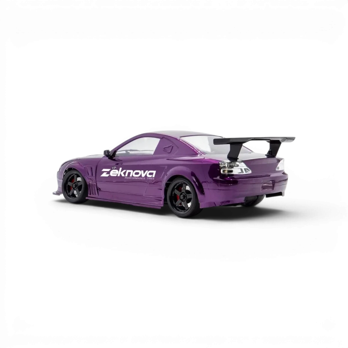 Châssis RC drift HOBBYTECH OVER-D10 RTR brushless RWD, vue de face avec composants et pneus de drift visibles.