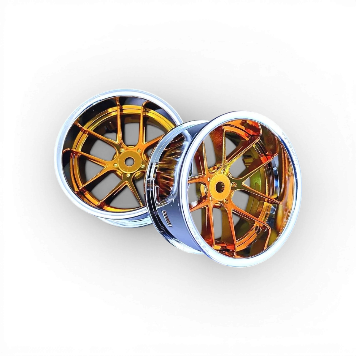 Deux roues Tetsujin avec cerclage chrome, centre Jasmine et disques chrome or, visibles en gros plan.