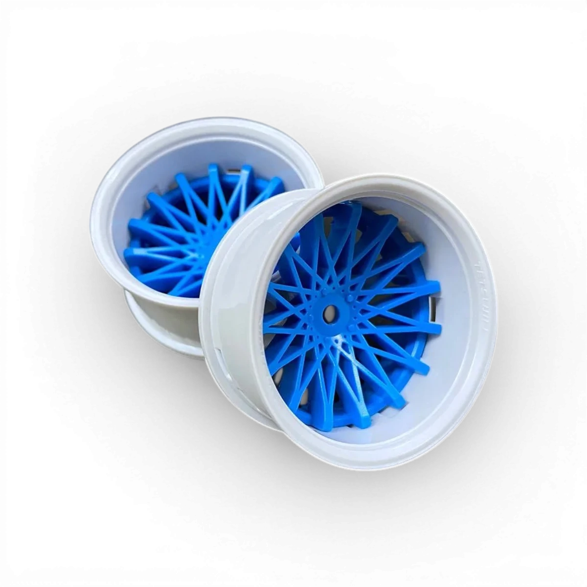 Roues Tetsujin Dahlia blanc et bleu, ensemble de roues pour voiture de drift, avec motifs colorés et design dynamique.