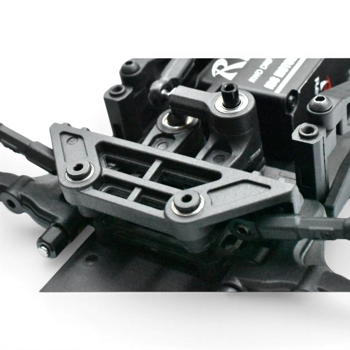 Direction RDX en graphite de Team Reve D, robuste pour drift, avec finition en graphite et design technique.