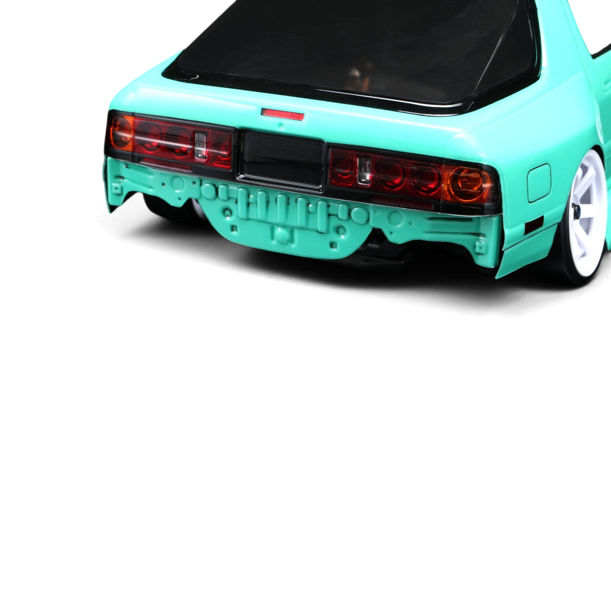 Vue arrière de la carrosserie DriftParadiZ Mazda RX-7 FC3S BN Sports turquoise avec pare-chocs arrière retiré