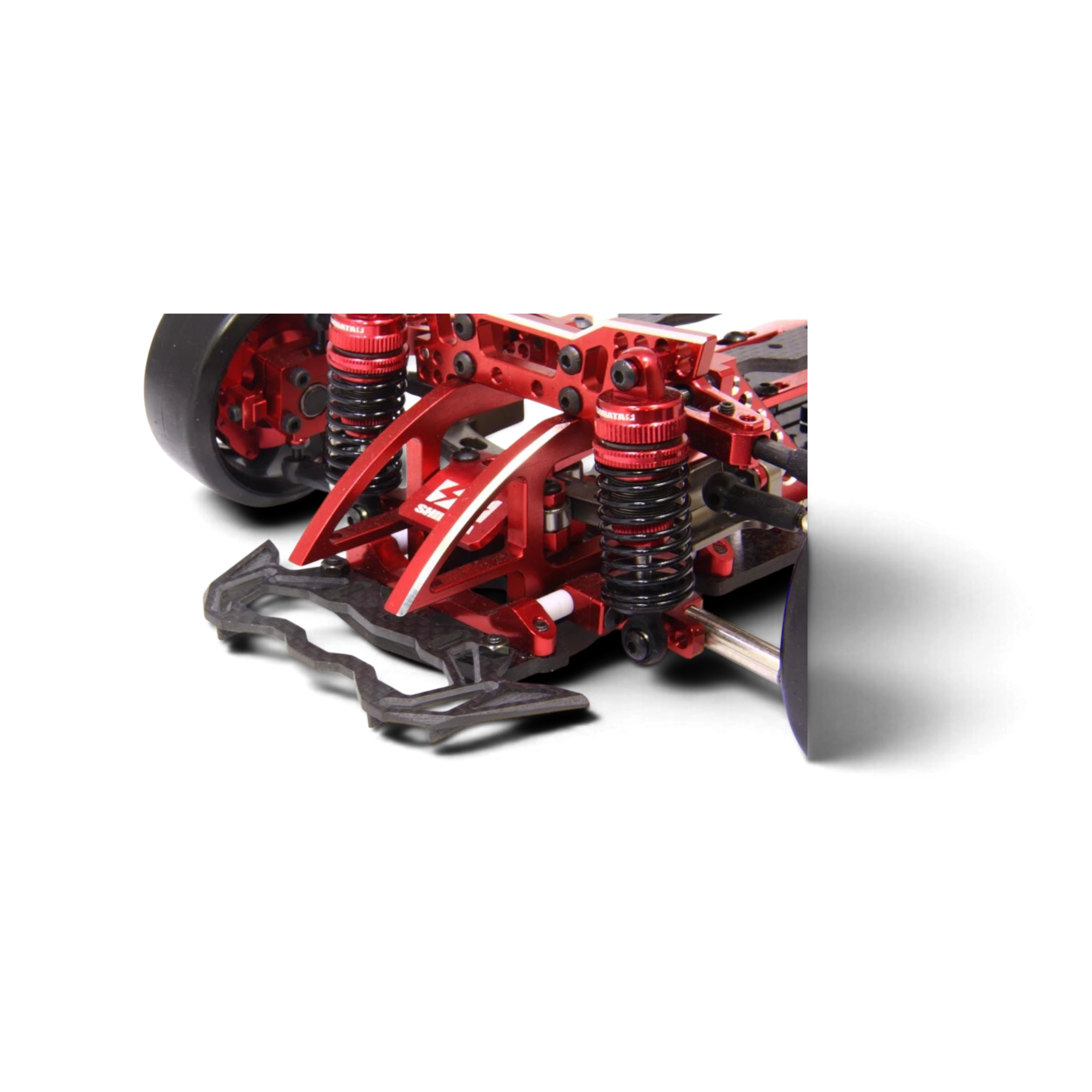 Pare-chocs en carbone brillant Hikotech avec ailettes aérodynamiques monté sur un châssis RC Drift DriftParadiZ