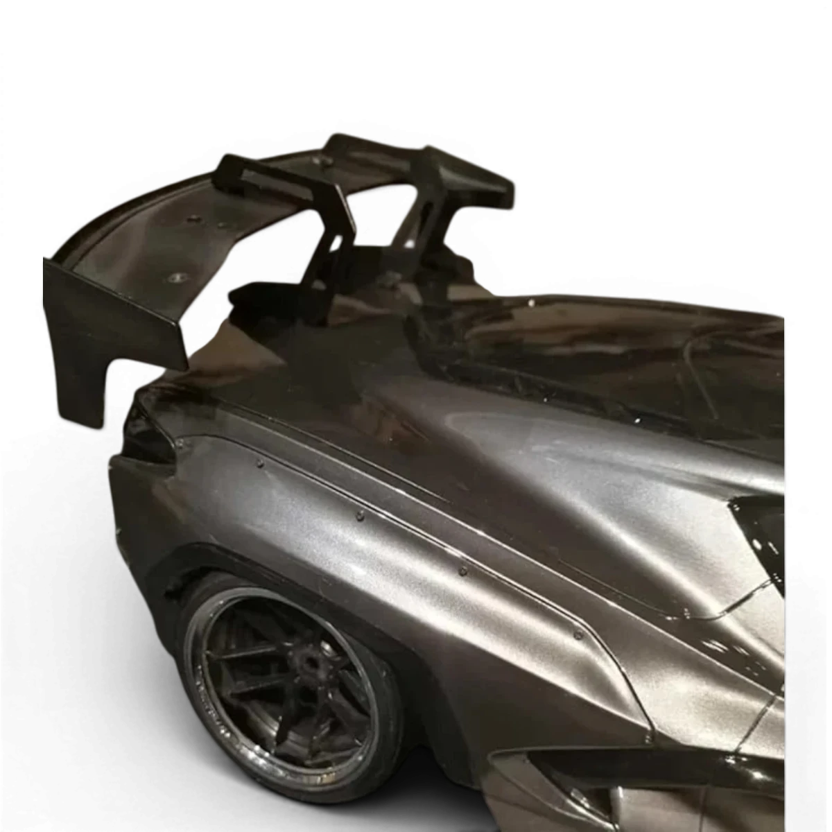 Support d'aileron DriftParadiZ en aluminium noir pour voiture RC drift, assurant une fixation stable de l'aile arrière.