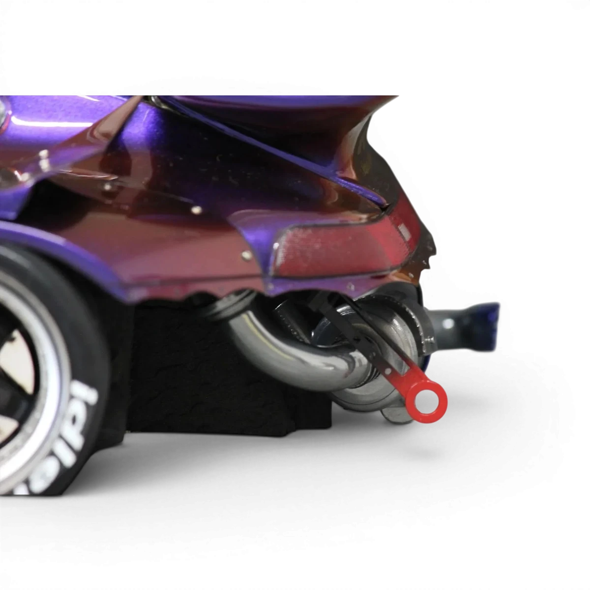 Échappement RWB Rotana Pandora RC, pièce de customisation pour véhicule, en finition noire avec détails métalliques visibles.