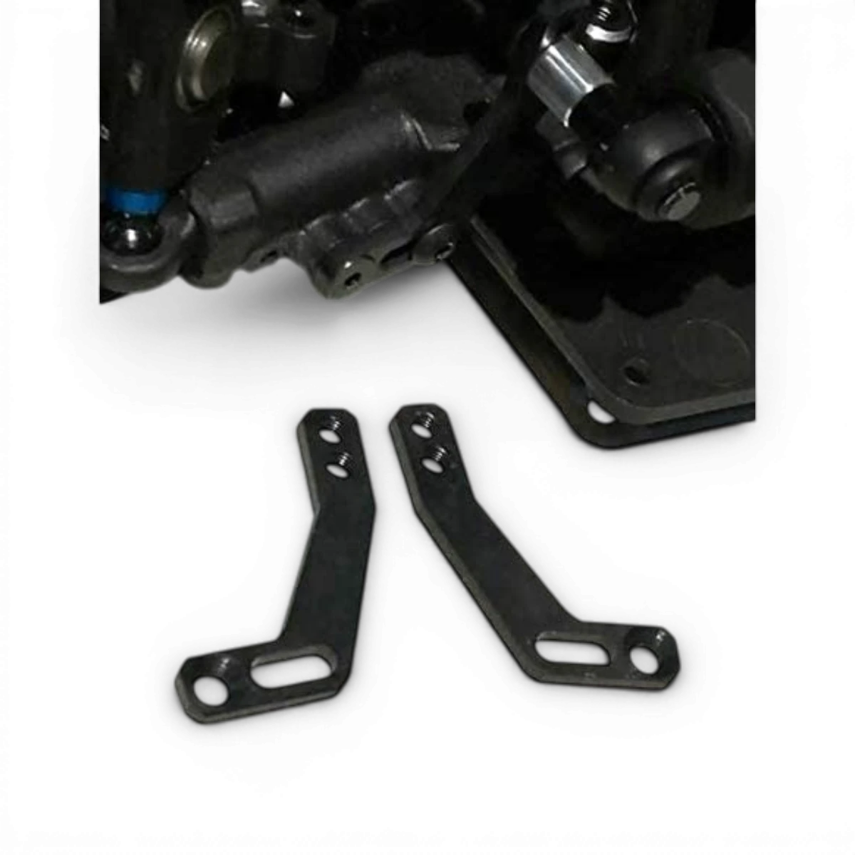 Équerres pour mono amortisseur en métal, conçues par Metal Garage, visibles en détail dans cette image.