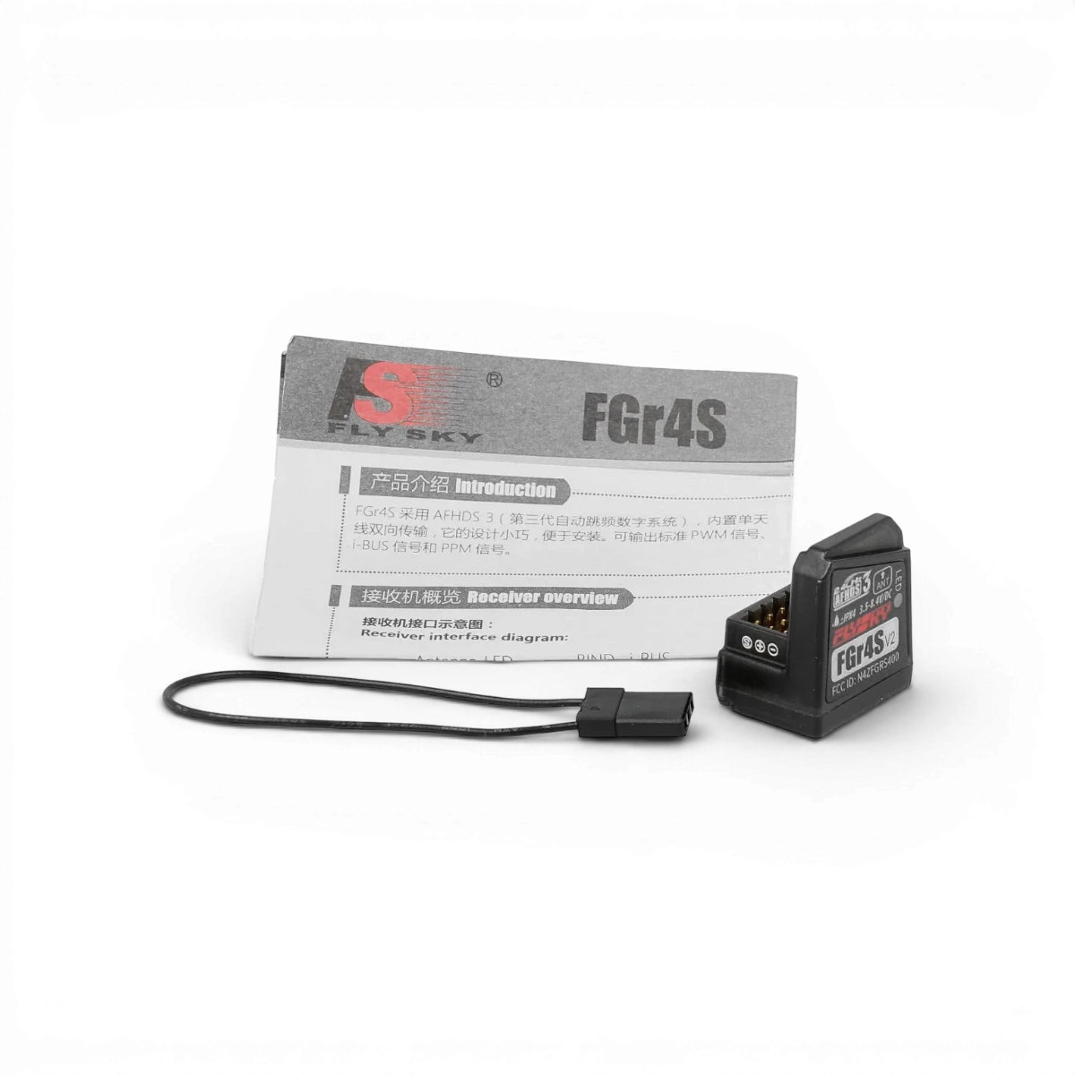 Récepteur électronique Flysky FGr4S AFHDS3 4CH avec antenne pour radiocommande, vue en gros plan.
