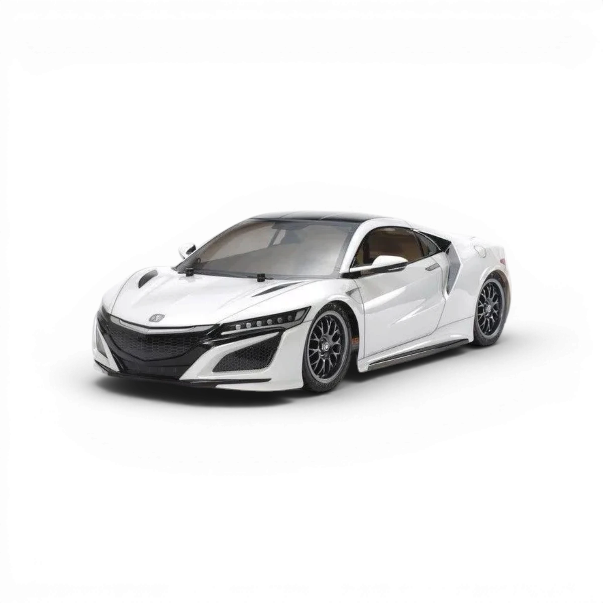 Carrosserie de voiture Honda NSX Tamiya, détail réaliste avec peinture bleue et finitions précises, vue de face sur fond blanc.