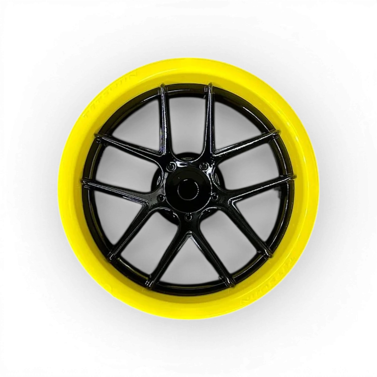 Deux roues Tetsujin avec cercles jaunes brillants et centres en disque noir brillant, comprenant un cercle et un disque.