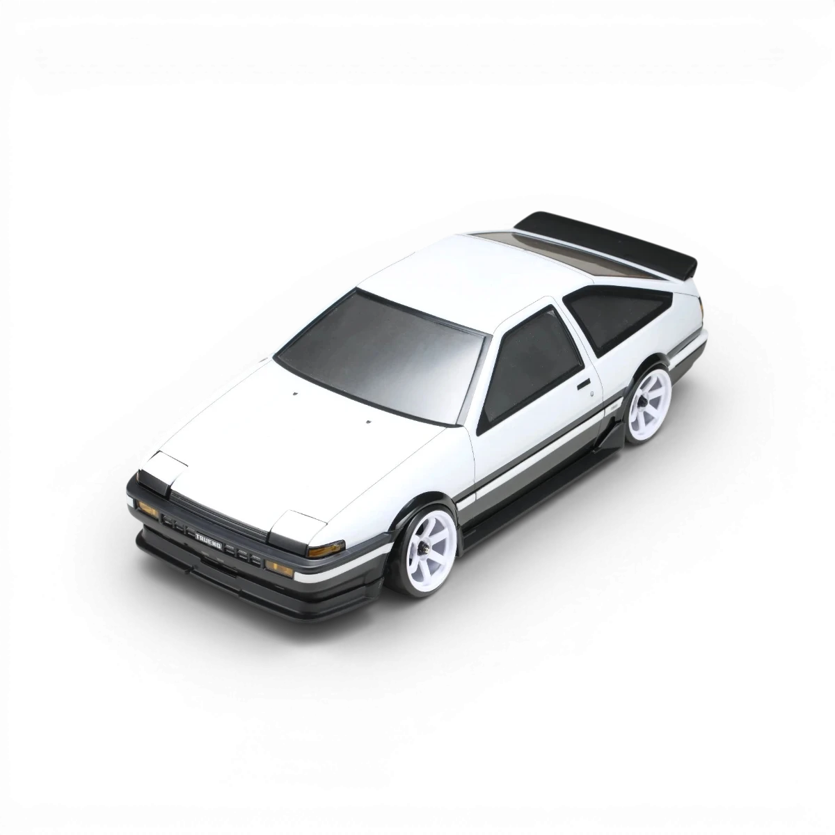 Kit carrosserie aérodynamique pour Toyota Sprinter AE86 Trueno 3 portes, marque Team Yokomo, visible dans l'image.