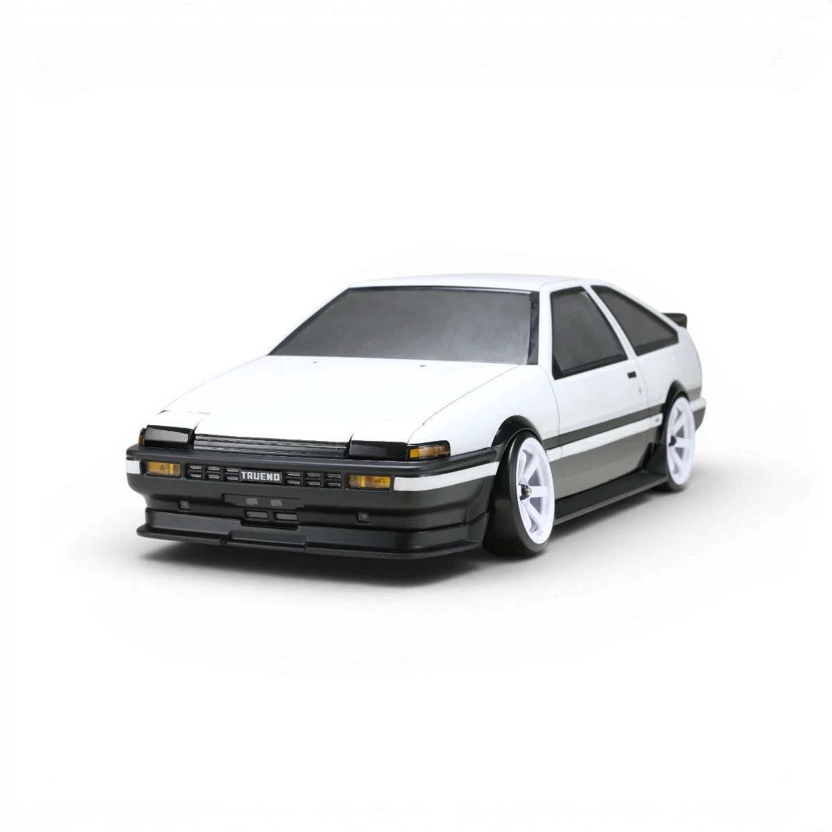 Kit carrosserie aéro pour Toyota Sprinter AE86 Trueno 3 portes, marque Team Yokomo, visible avec détails de la carrosserie.
