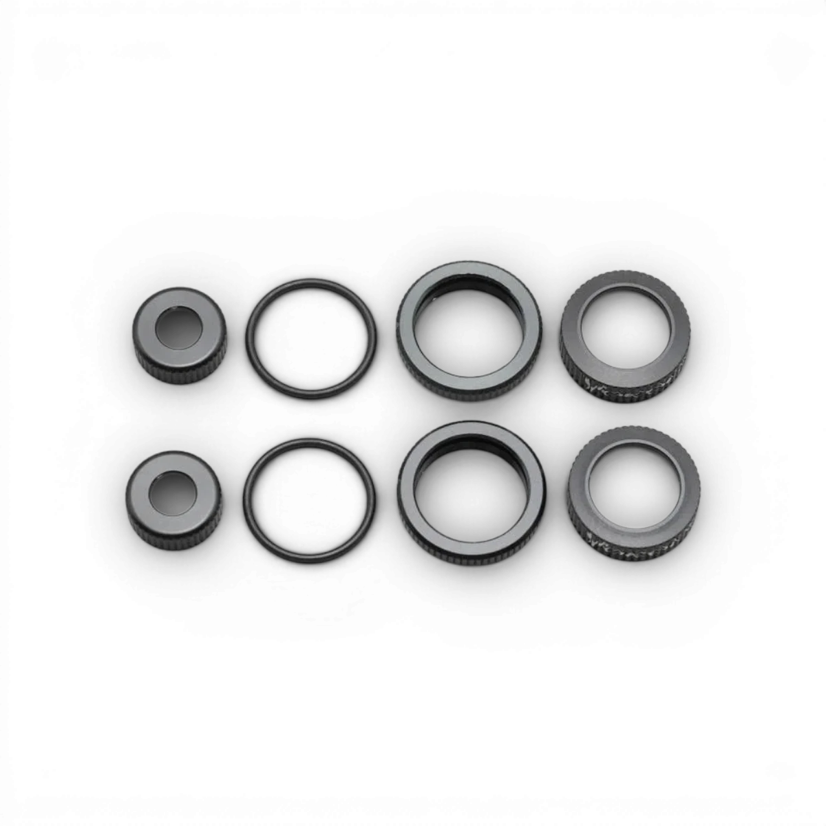 Kit bouchons Bigbore noirs de Team Yokomo, pièces détachées pour voitures RC, visible en image.