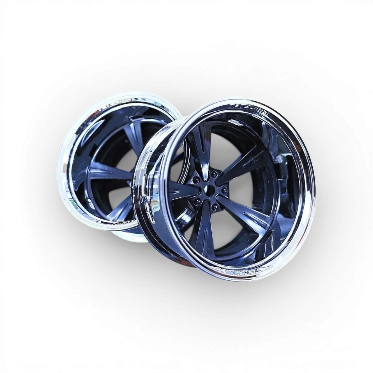Roues Tetsujin Mandarin chrome et noir pour voiture, design élégant et finition brillante, parfait pour la personnalisation automobile.