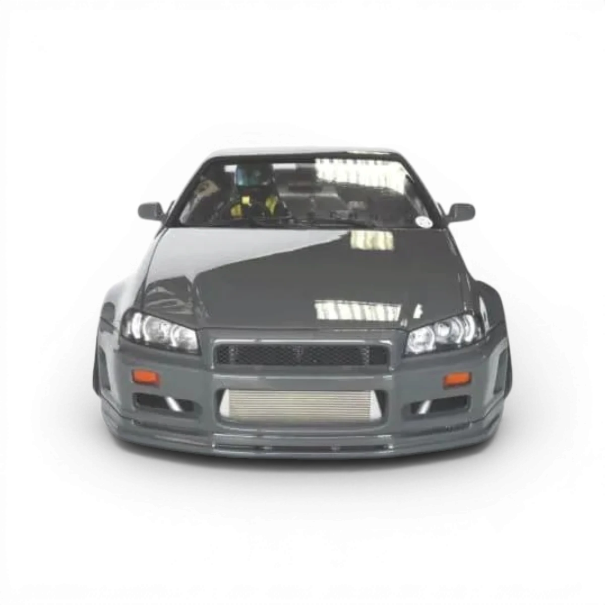 Carrosserie Nissan R34 de la marque Aplastics RC, modèle pour voiture télécommandée, en plastique avec détails précis.