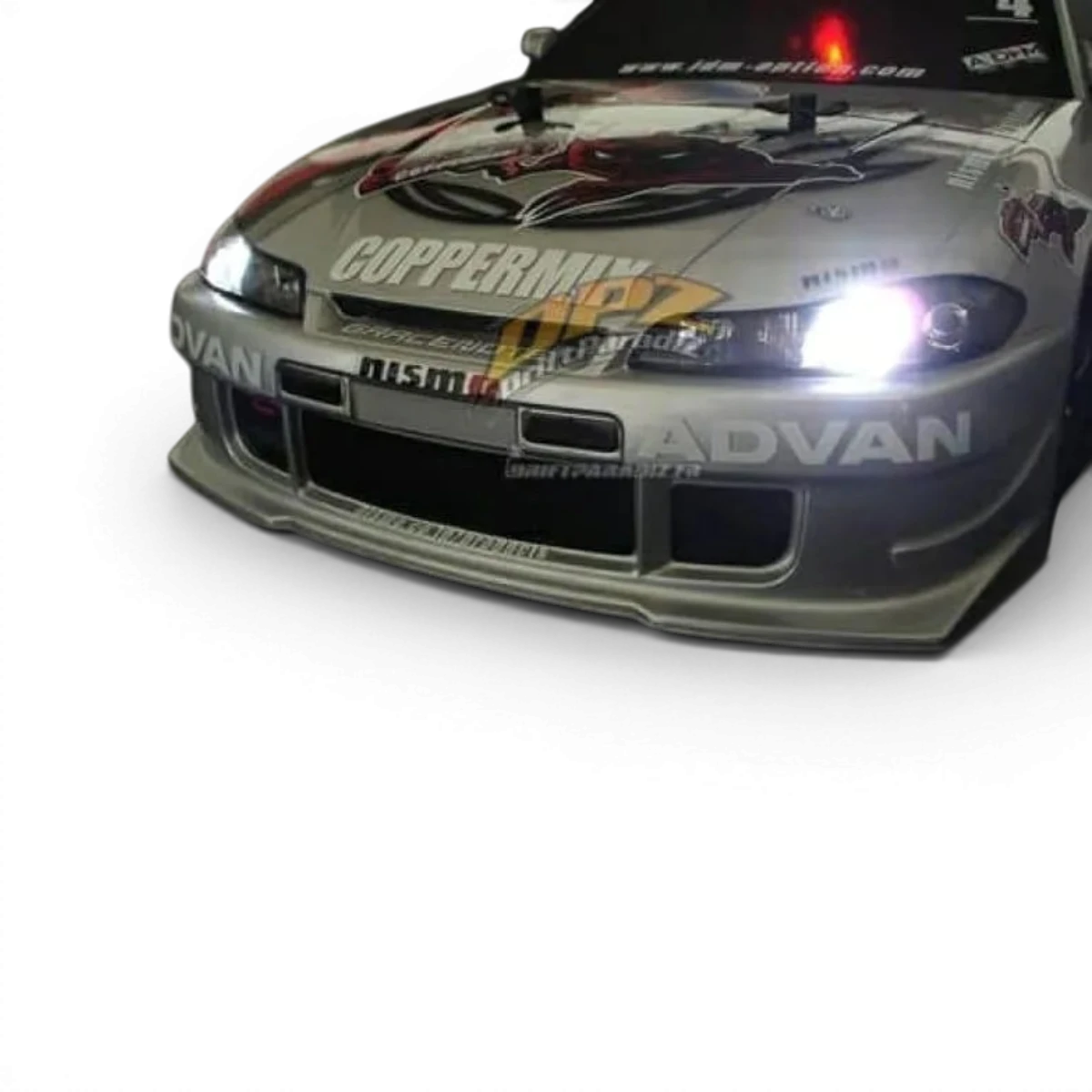 Modèle de carrosserie Nissan Silvia S15 Tamiya, voiture de drift détaillée avec peinture bleue et aileron arrière.