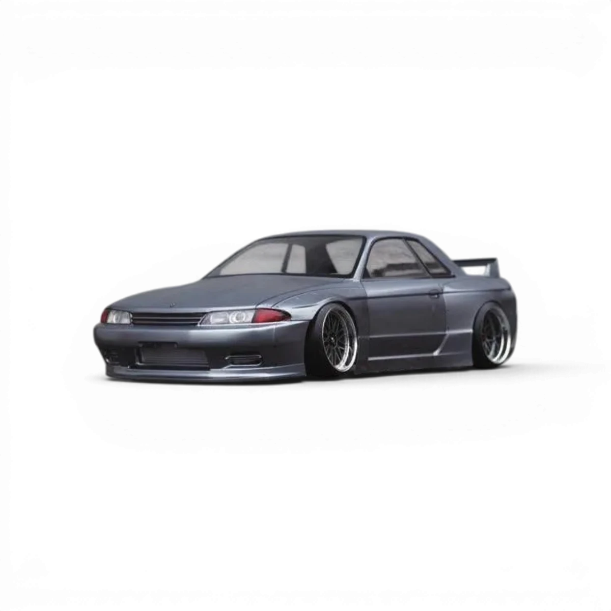 Carrosserie pour Nissan Skyline R32 GTR, modèle Addiction RC Design, vue de face avec détails de la carrosserie.