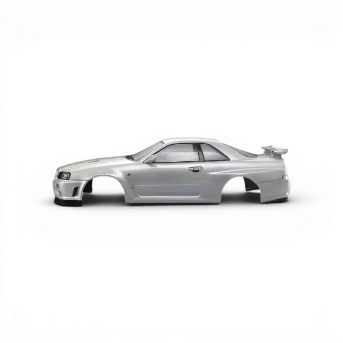 Carrosserie Nissan Skyline R34 GTR blanc perle de la marque Killer Body, vue détaillée du kit de carrosserie.