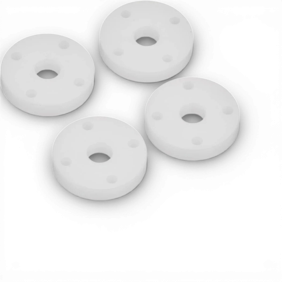 Pistons 4 trous big bore de la marque Team Axon, pièces détachées pour moteur, visibles avec leur design robuste.