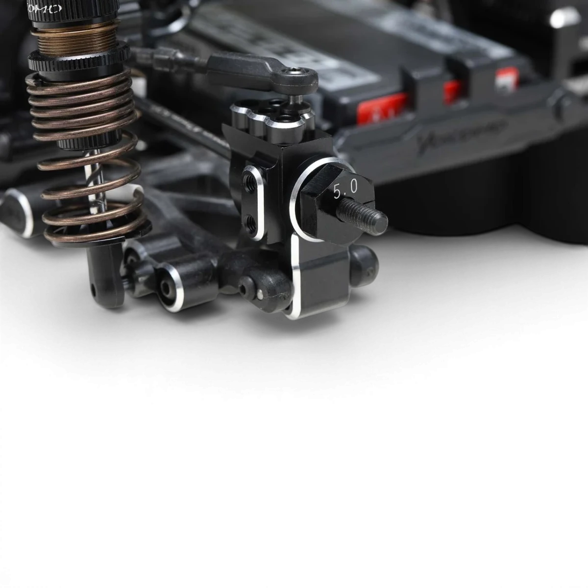 Porte-moyeux arrière en aluminium pour voiture RC Team Yokomo, pièce durable et légère, visible sur l'image.