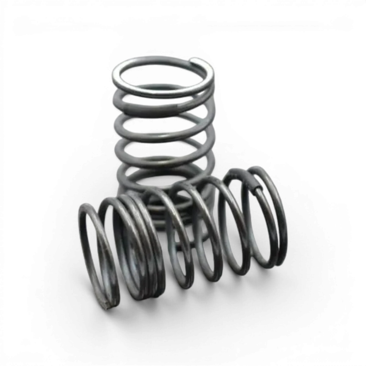 Ressorts arrière R-tune medium de Team Reve D, pièce détachée pour véhicule, visibles en position sur une voiture de drift.