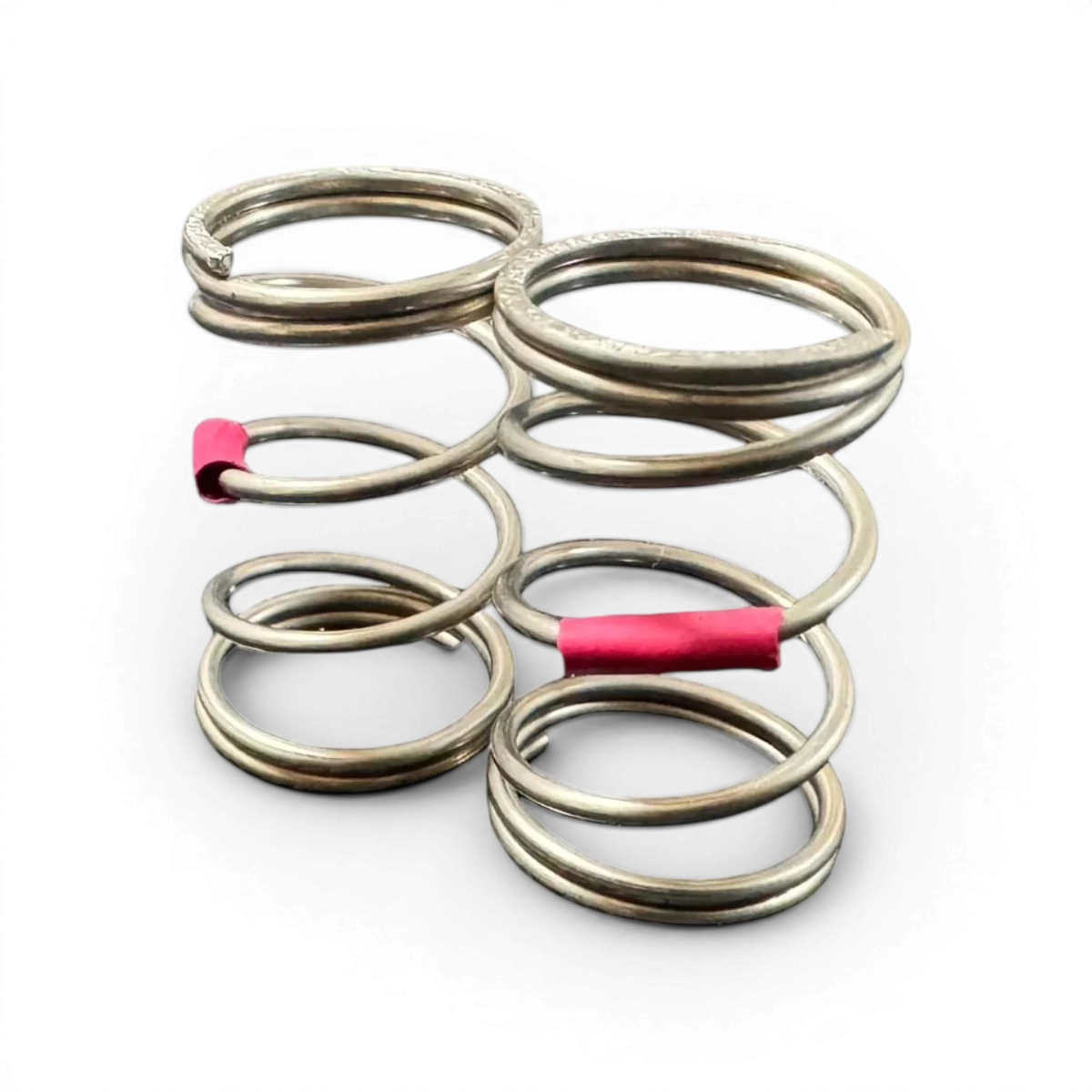Ressorts AST 27 dur de la marque Topline, visibles en gros plan avec surface métallique et spirale résistante.