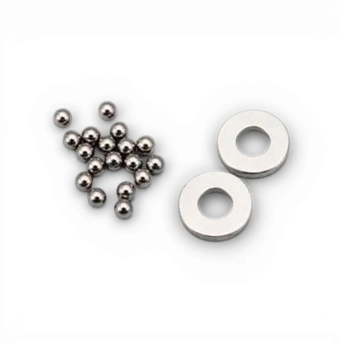 Rondelles et billes pour vis de différentiel à billes, pièces détachées pour modèle Team Yokomo, visibles en gros plan.