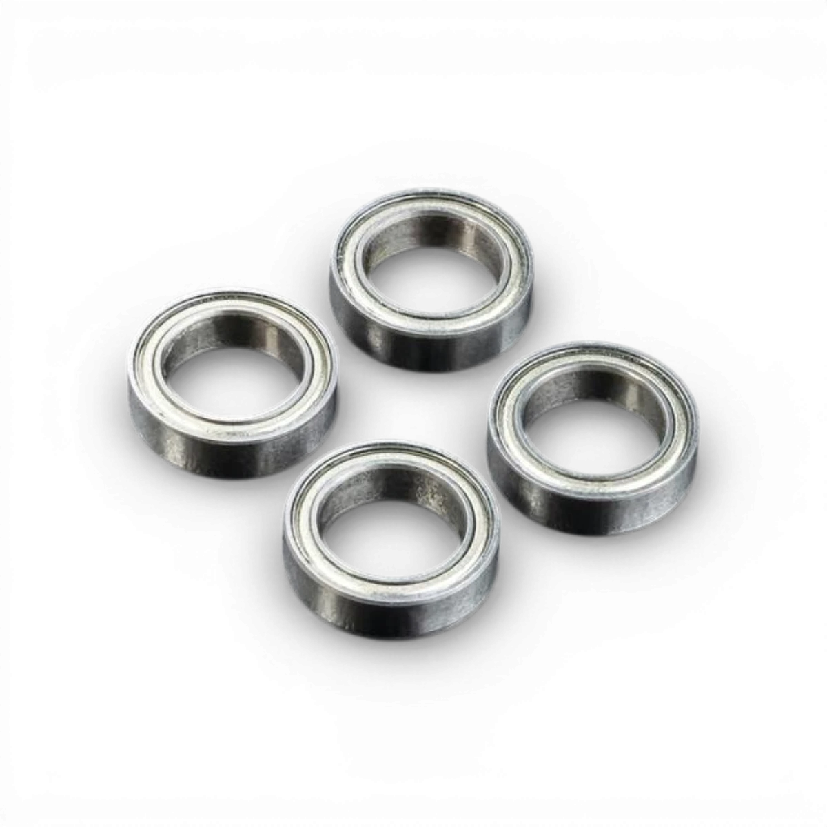 Quatre roulements Max Speed Technology de 10x15 mm, pièces détachées pour machines, en métal avec billes visibles.