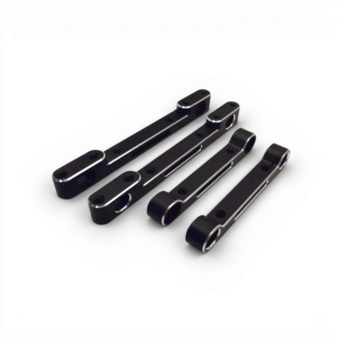 Ensemble de cales en aluminium en forme de triangles Shark de RhinoRacing pour ajustements de véhicules.