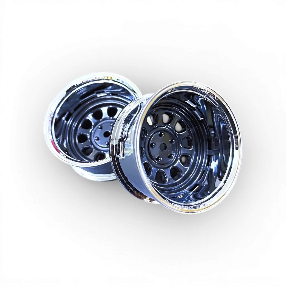 Ensemble de roues Tetsujin Sunflower en chrome et noir, avec jantes modernes et finition brillante.