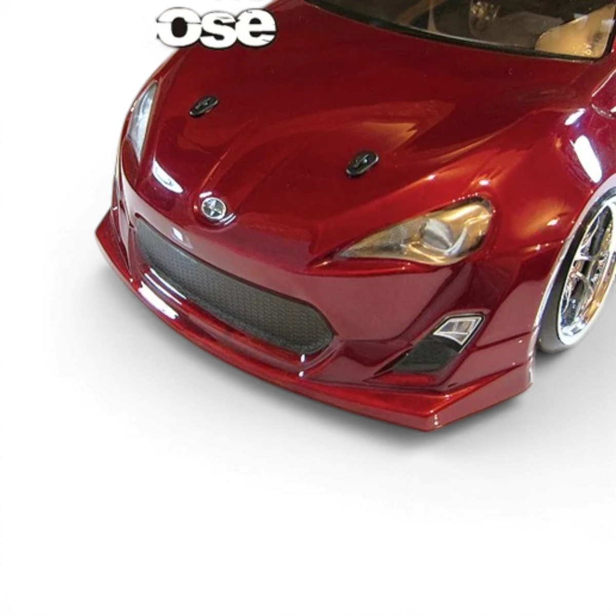 Support de carrosserie "attache capot" Overdose, pièce de customisation pour fixation du capot, en métal robuste, visible en image.