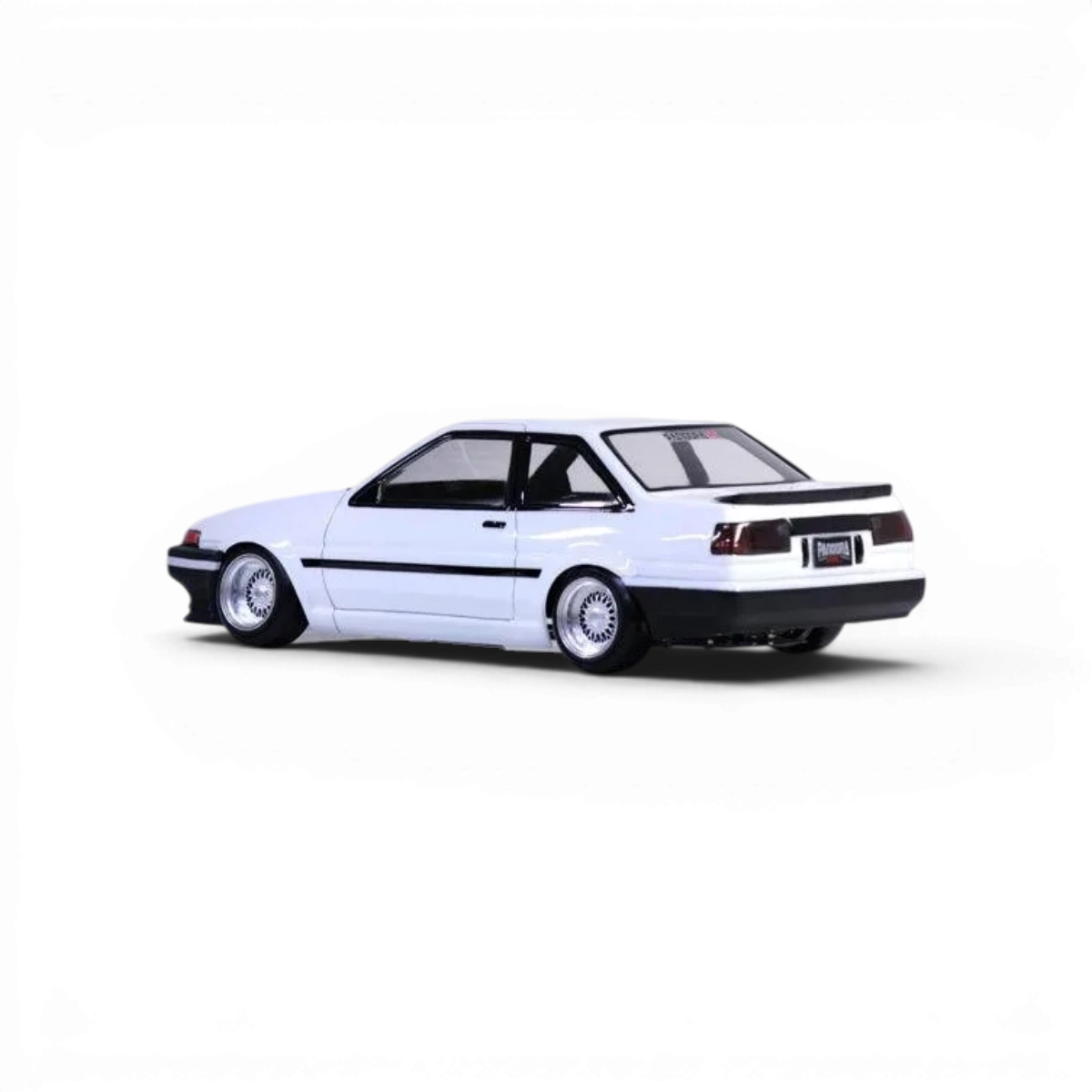 Voiture radiocommandée Toyota AE86 Trueno 2 portes de la marque Pandora RC, vue de côté avec détails de la carrosserie.