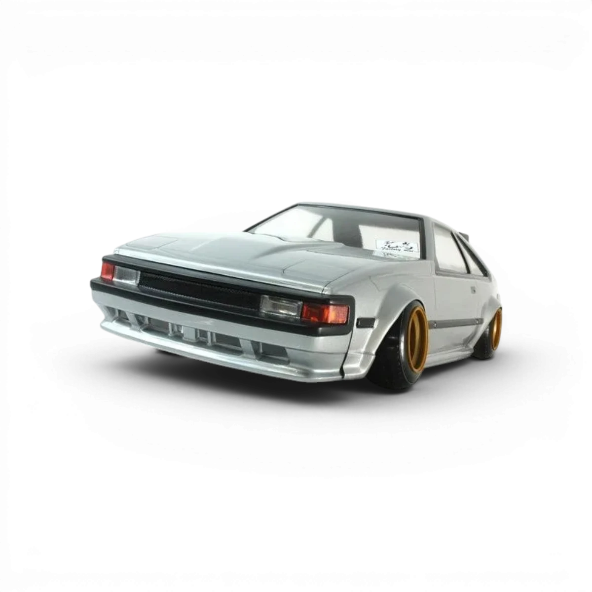Carrosserie Pandora RC Toyota Celica XX (A60) pour modèle réduit, détails précis et design réaliste visible sur l'image.