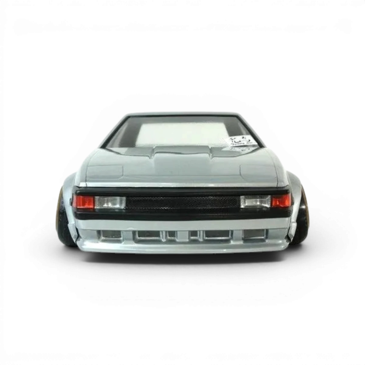 Voiture télécommandée Toyota Celica XX A60 Pandora RC, carrosserie de modèle réduit pour drift, vue de face sur fond blanc