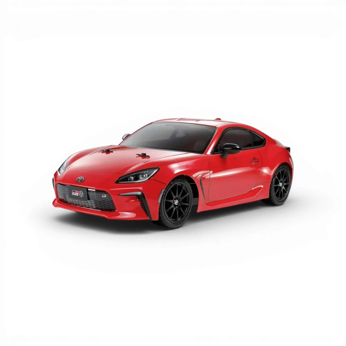 Modèle de carrosserie Toyota GR86 de la marque Tamiya, détaillée et réaliste, vue de face sur fond blanc.