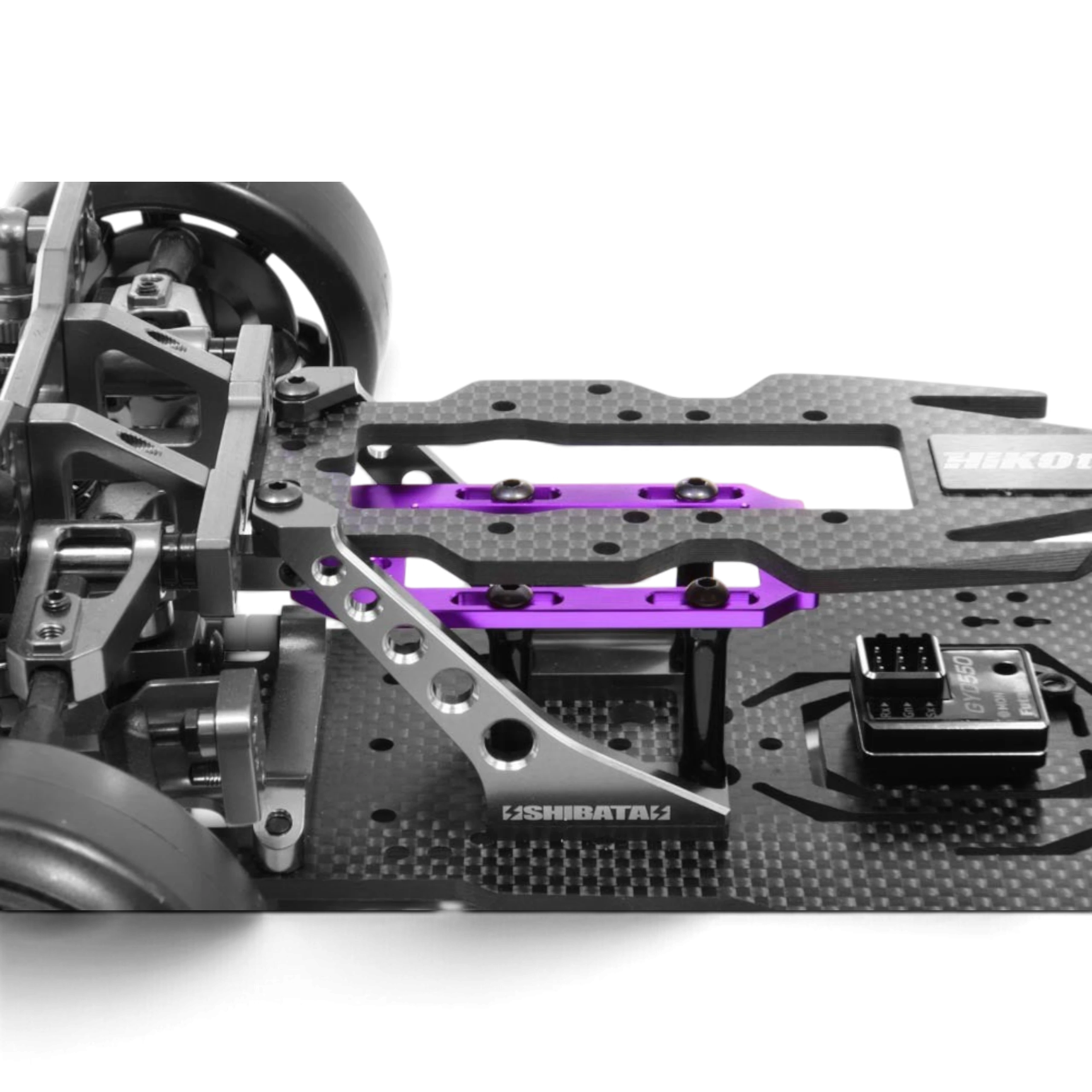 Plaque de support servo en aluminium violet DriftParadiZ installée sur un châssis de voiture RC SHIBATA GRK5
