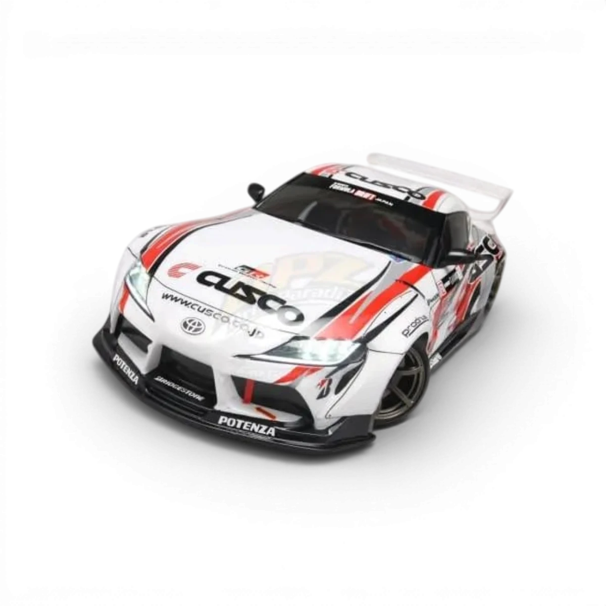 Buckets de lumière et aileron pour Toyota Supra A90, pièces de customisation de la marque Team Yokomo, visibles sur l'image.