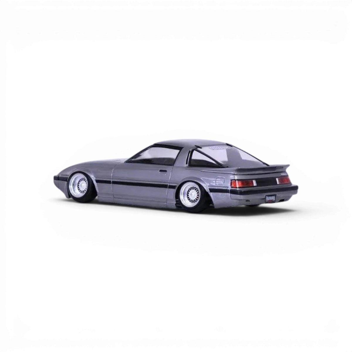 Voiture radiocommandée Mazda Savanna RX-7 SA22C Pandora RC, carrosserie détaillée pour drift et modélisme automobile.