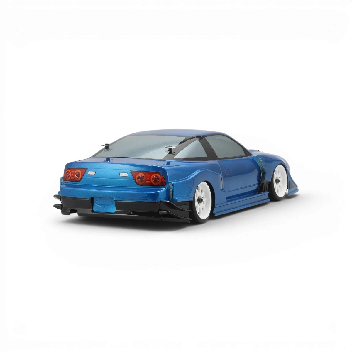 Carrosserie Nissan 180SX GP Sports pour voiture RC, marque Team Yokomo, vue détaillée de la carrosserie avec design noir et blanc