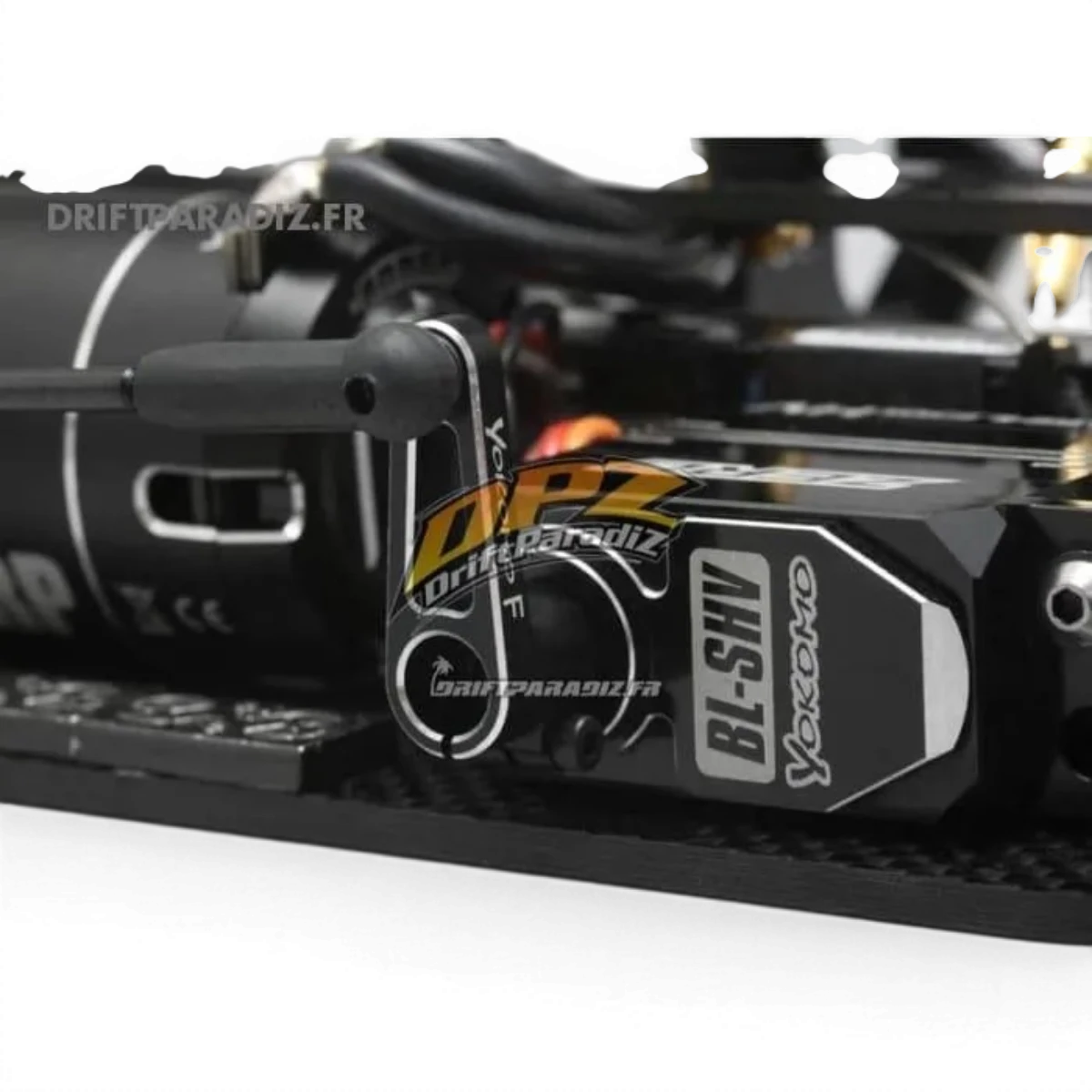 Palonnier pour servos 25T de 20mm, pièce électronique de la marque Team Yokomo, visible en détail dans l'image.