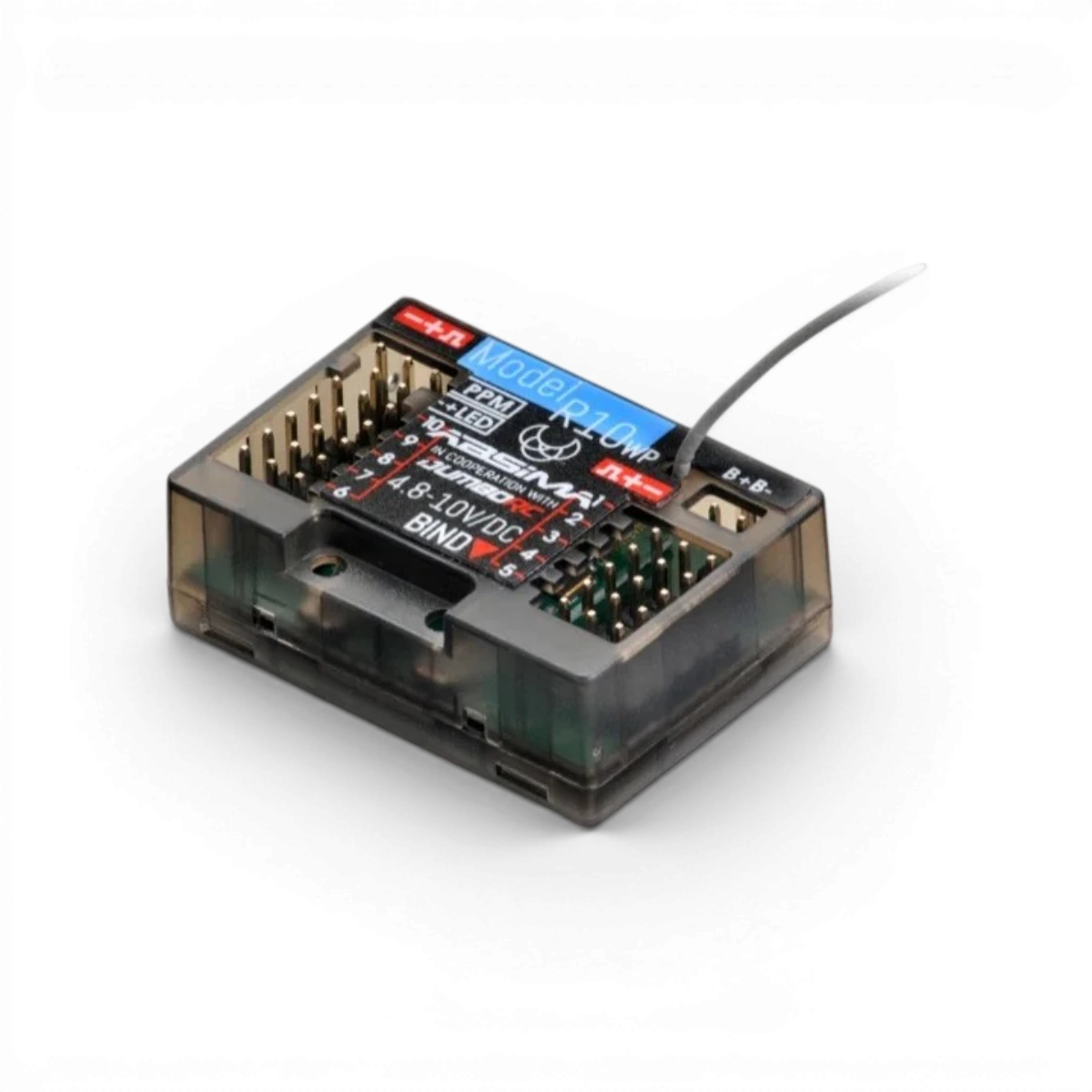 Radio 10 voies CR10P Absima 2,4 GHz avec récepteur électronique noir et boutons de contrôle visibles.