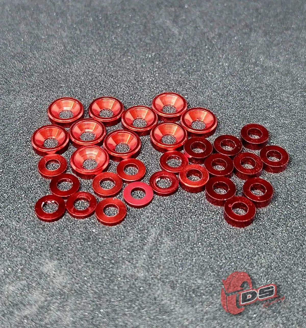 Ensemble de rondelles DS Racing, pièces détachées, montrant plusieurs rondelles en métal pour réparation ou montage.