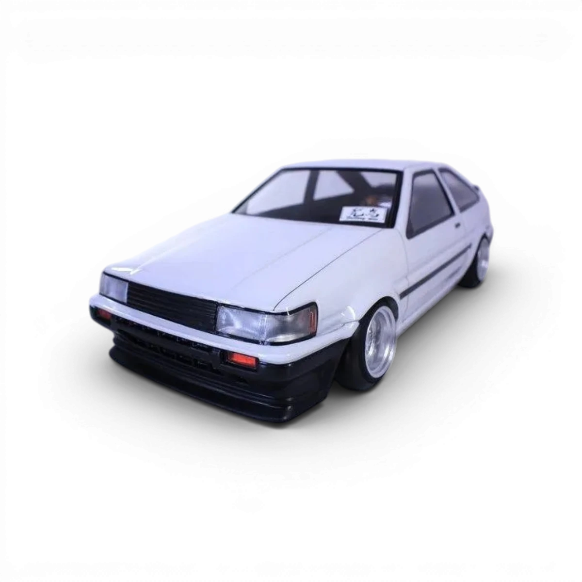 Voiture téléguidée Toyota AE86 Levin 3 portes Pandora RC, modèle de carrosserie pour collection ou drift, vue de côté.